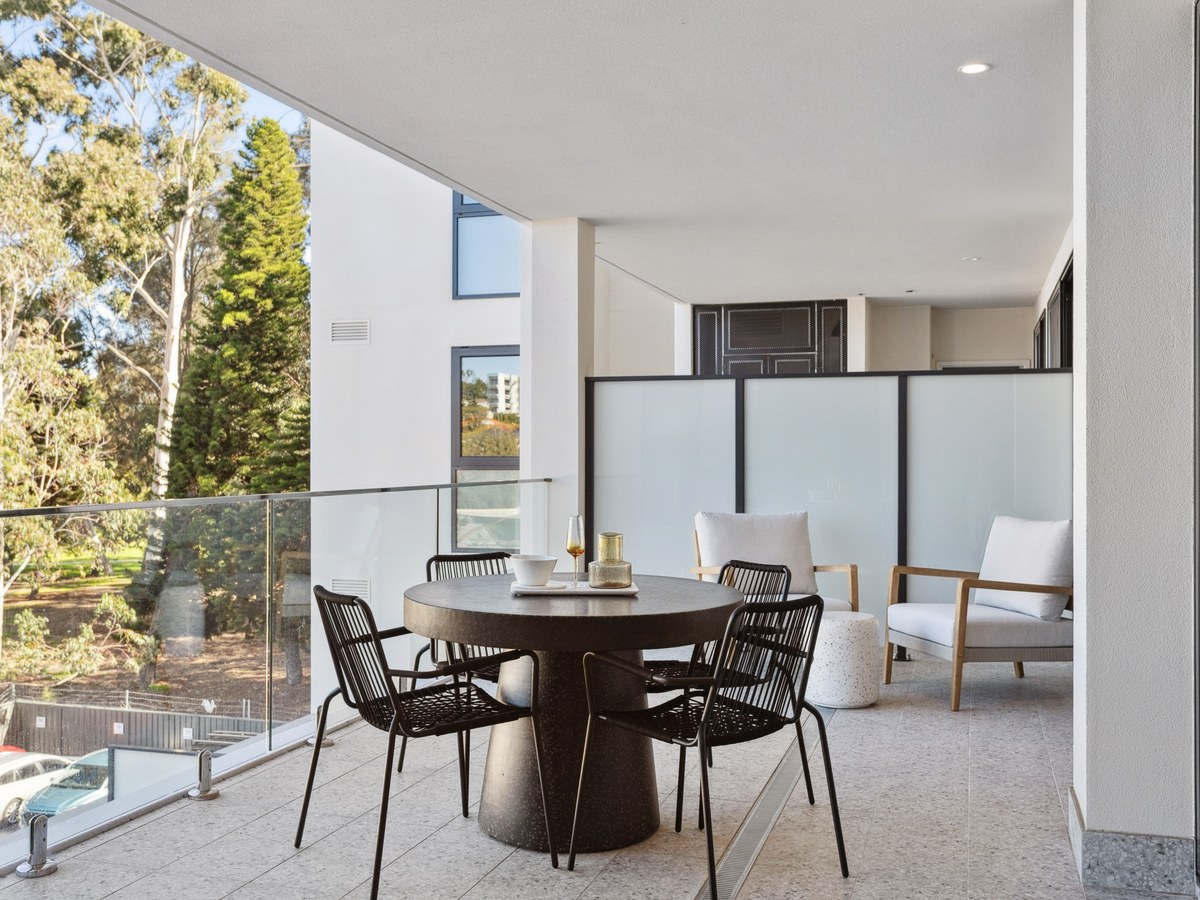 Burswood apartment balcony with outdoor dining and leafy outlook