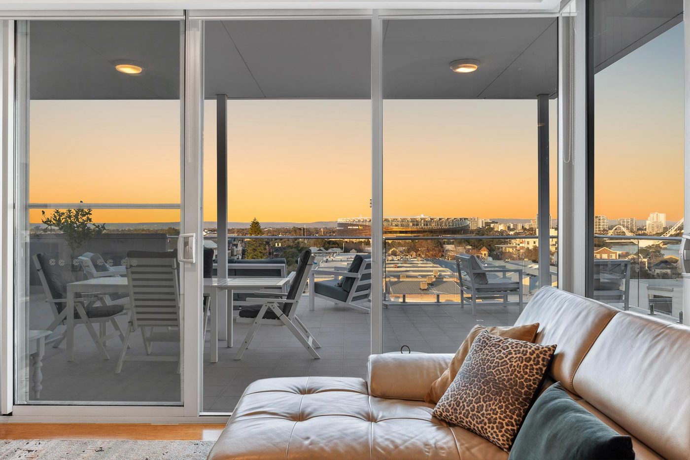 A Guest Pro Perth managed apartment overlooking the Perth skyline at sunset